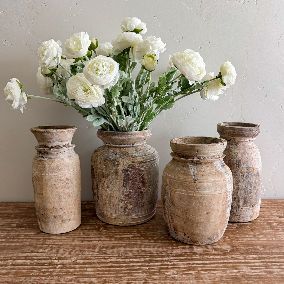 Bleached wood vases with white flowers