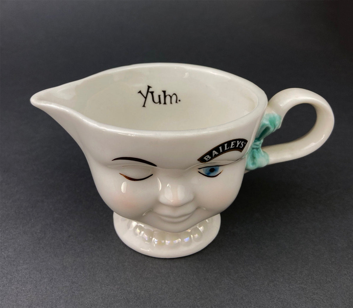 Bailey's Winking Face Creamer with Blue Bow
